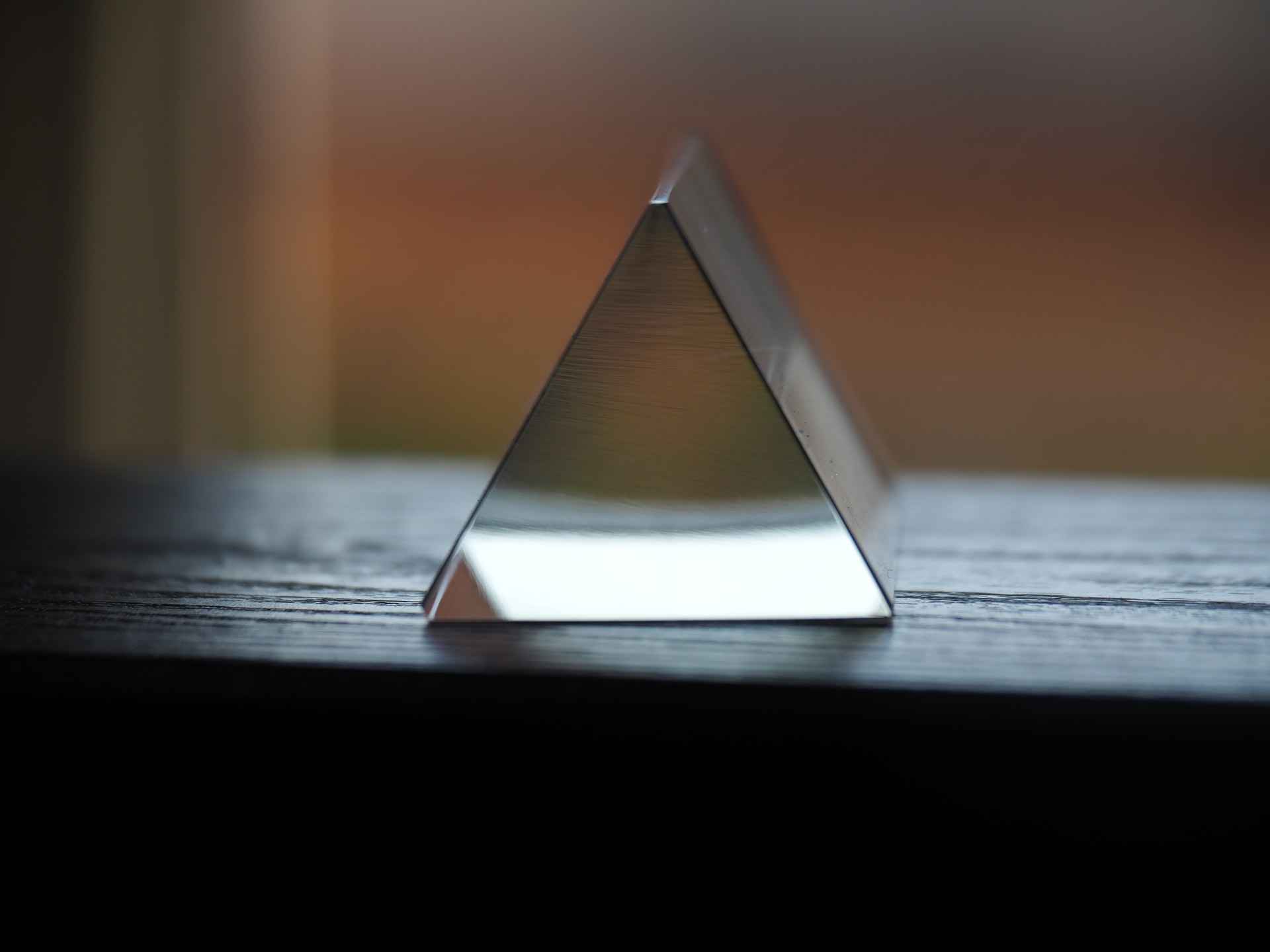 A glass triangle representing the fraud triangle