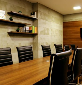A conference room representing ways a corporation can optimize benefits under the small business deduction