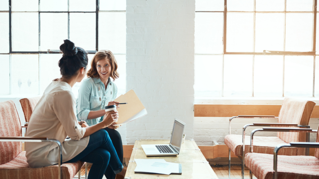 An image of two business owners discussing their business loan