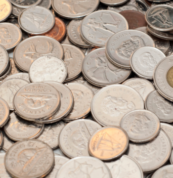 An image of Canadian coins on a table in a small business office in Burlington