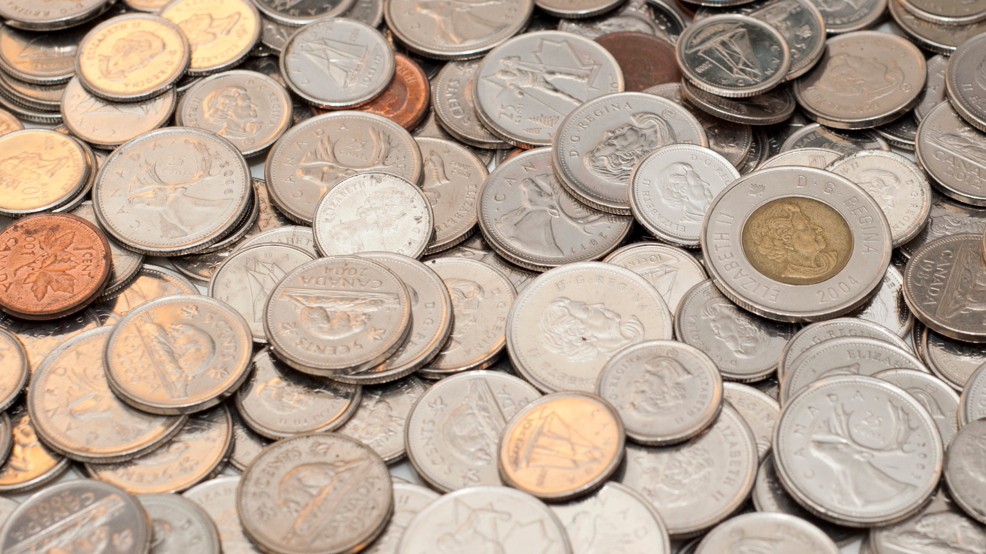 An image of Canadian coins on a table in a small business office in Burlington