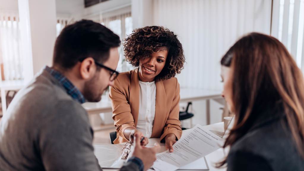 Two small business owners in Burlington discussing how to raise capital for their growing operation.