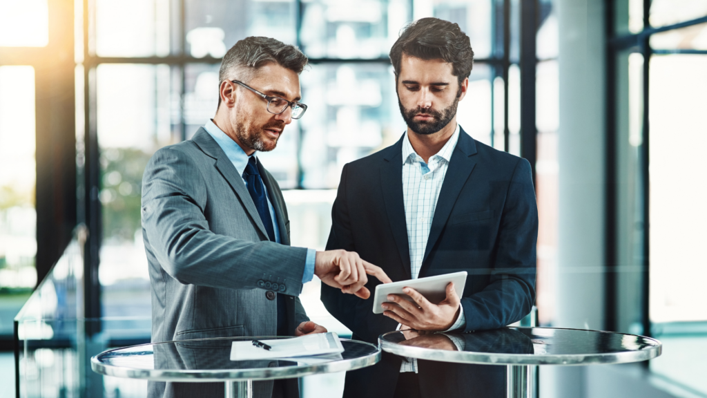 An image of a small business owner discussing their holding company with their local accountant