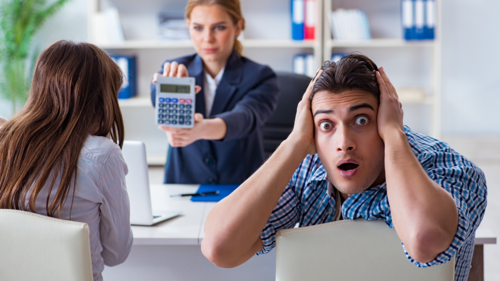 An image of a couple small business owners in Burlington coming to grasp with the rising interest rates.