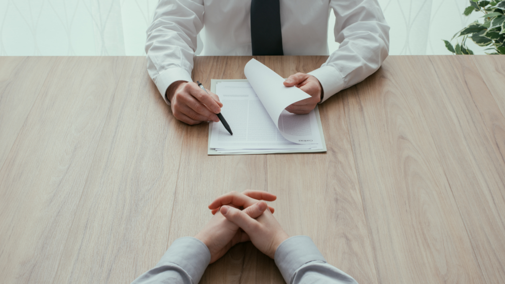 In image of a small business owner hiring a new staff member for his team.