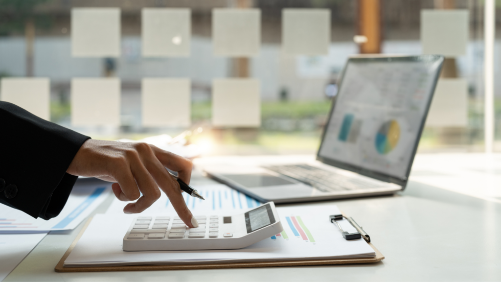 An image of a local Burlington bookkeeper doing bank reconciliation for his client.