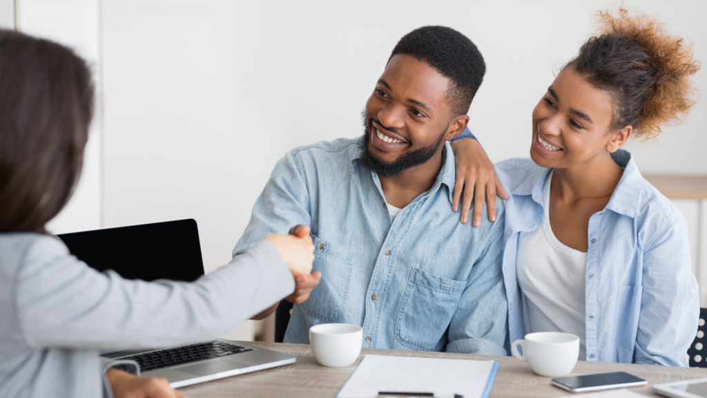 An image of a small business owner and his spouse discussing shareholder options for the local Burlington Business.