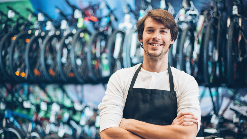 An image of a small business owner who has just registered his business name for his bike shop.