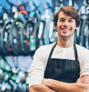 An image of a small business owner who has just registered his business name for his bike shop.