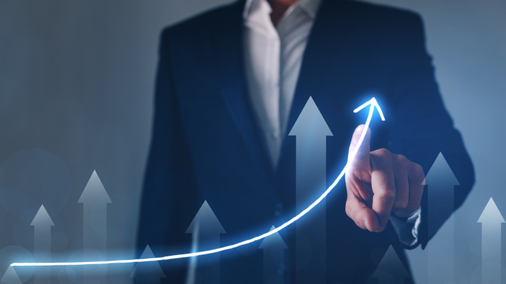 An image of a small business advisory touching a graph on a virtual whiteboard.