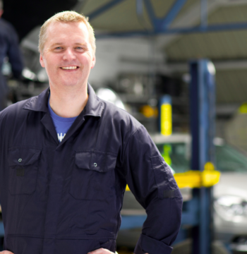 An image of a small business owner in his auto shop in Burlington Ontario