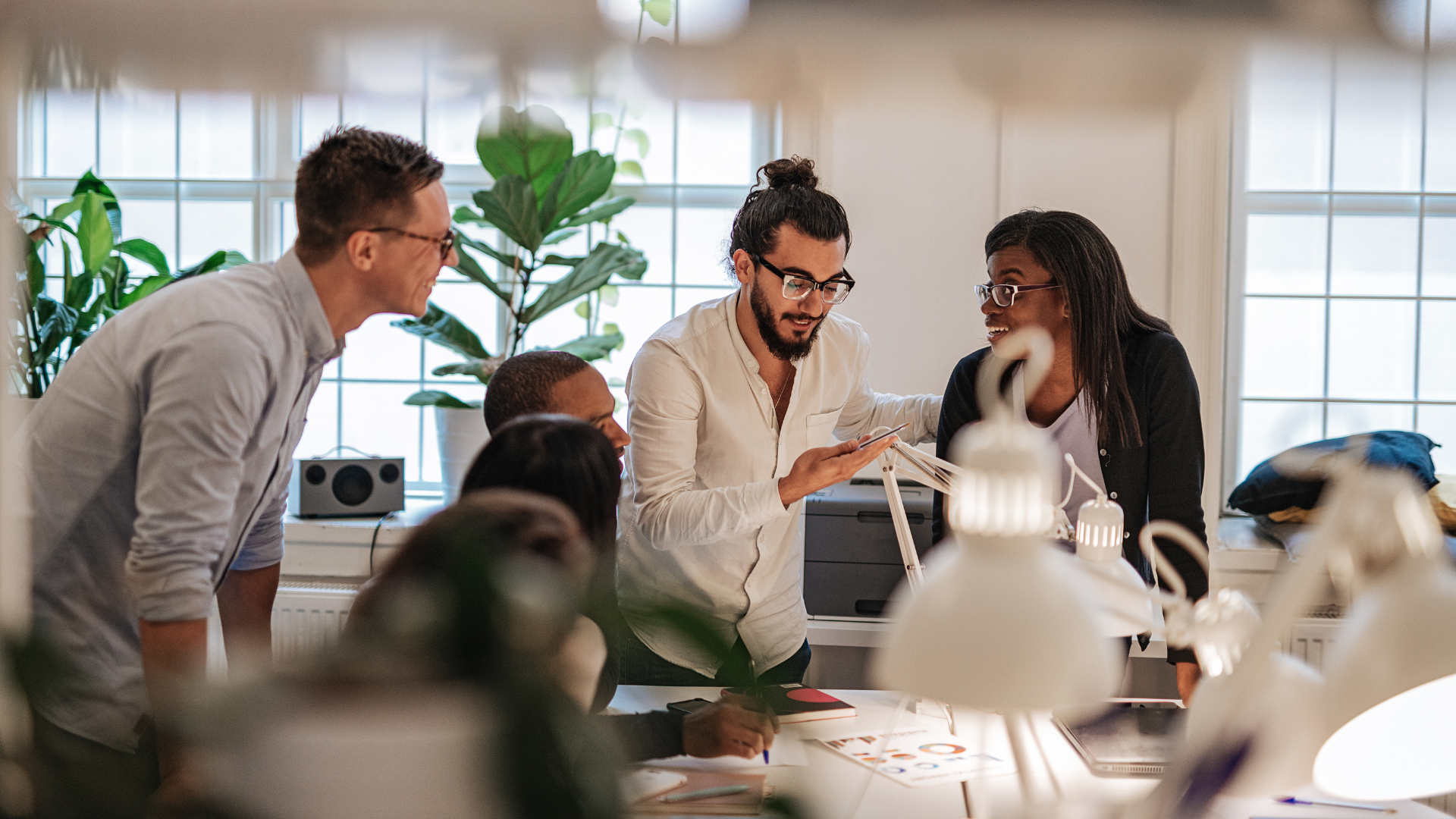 An image of a team meeting at a small Burlington startup