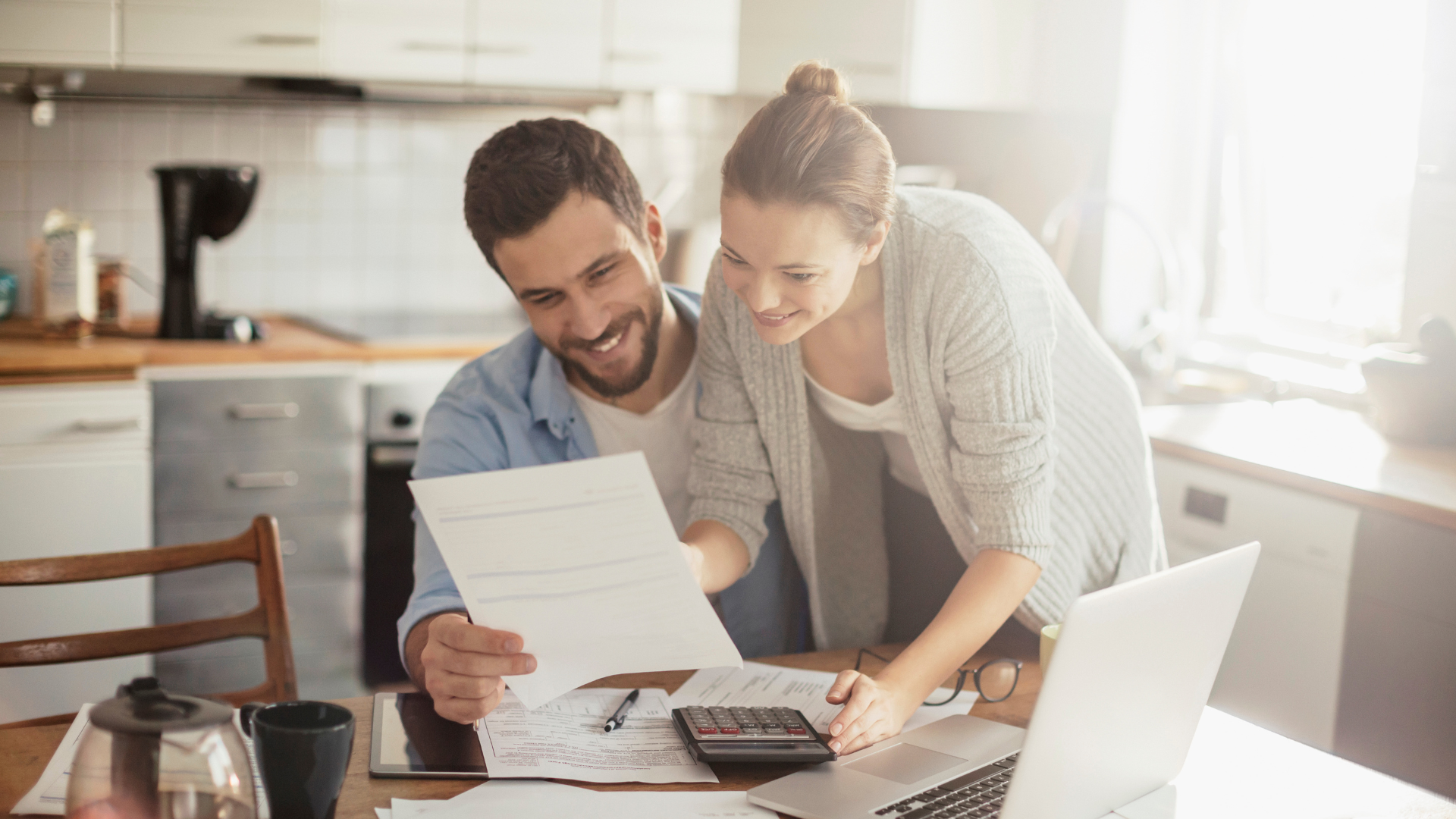 An image of a couple who are reviewing their small business budget that was prepared by a local Burlington CFO