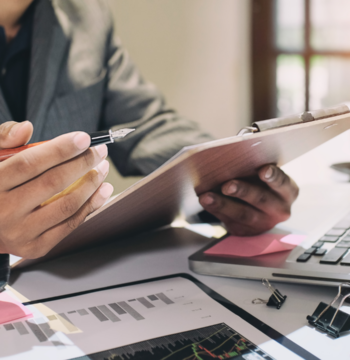 An image of a small business owner reviewing their small business records