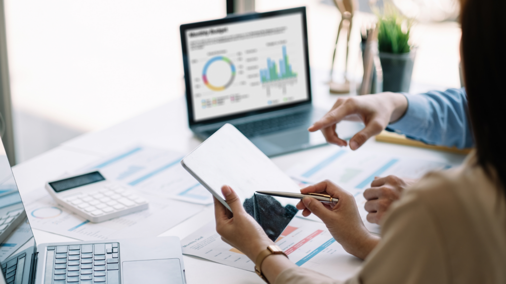 An image of a local Burlington CPA helping her client with their cloud accounting software install.