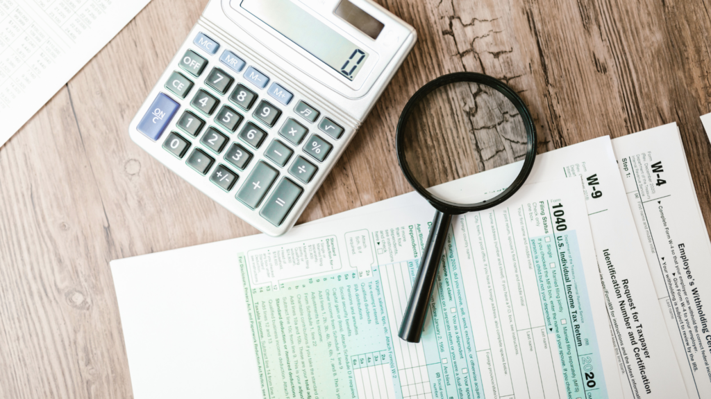 An image of a cross border tax advisory in Burlington with several US tax forms ready to be filled in with their client.