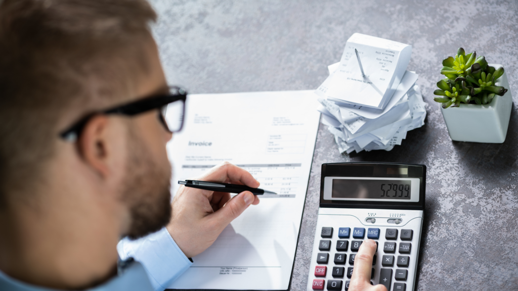 An image of a business owner in Hamilton who is reviewing his business expenses after meeting with his CPA firm in Burlington