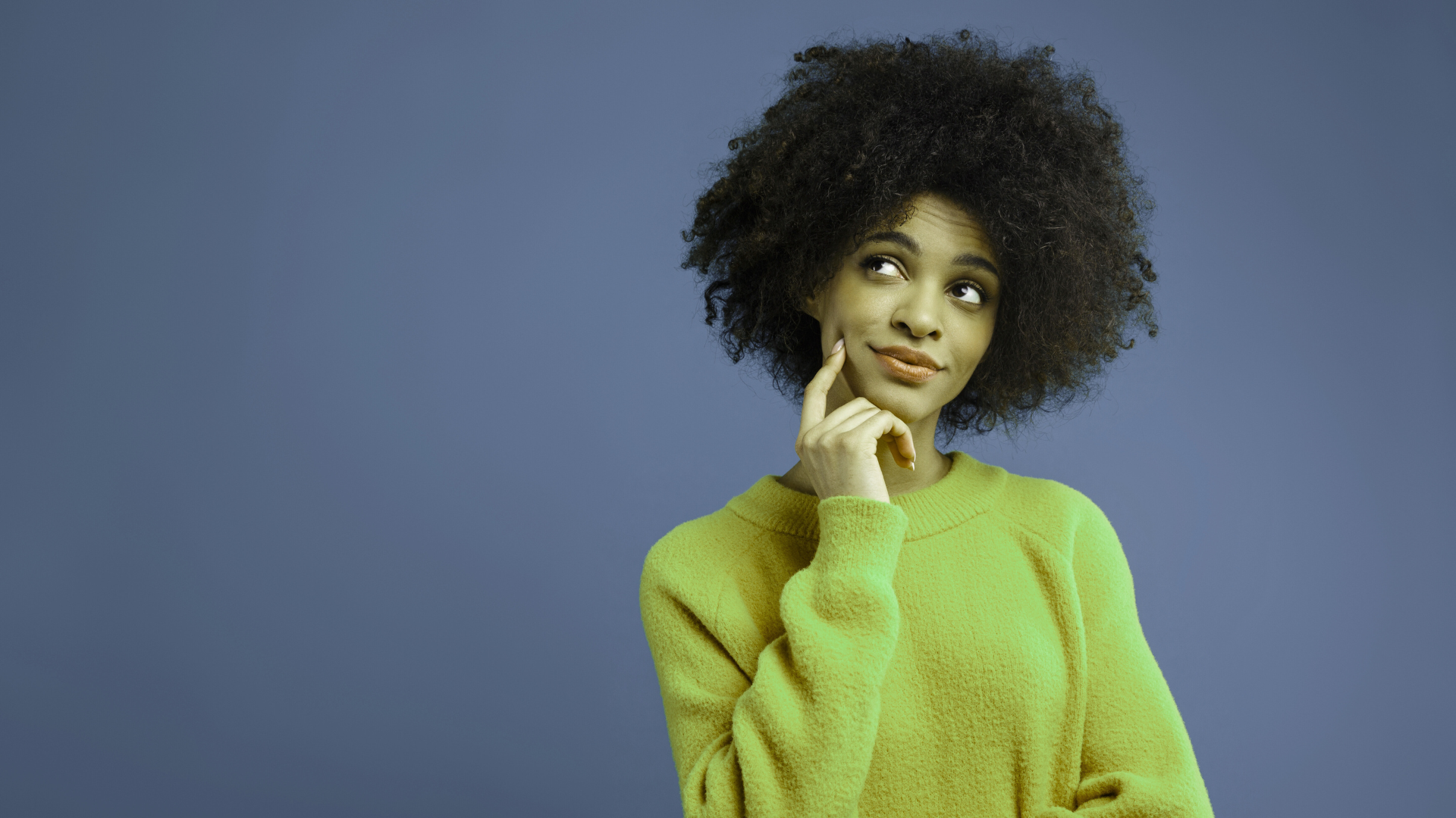 An image of a small business owner in Halton region thinking about the frequently asked questions (FAQs) that she has for her local accounting firm