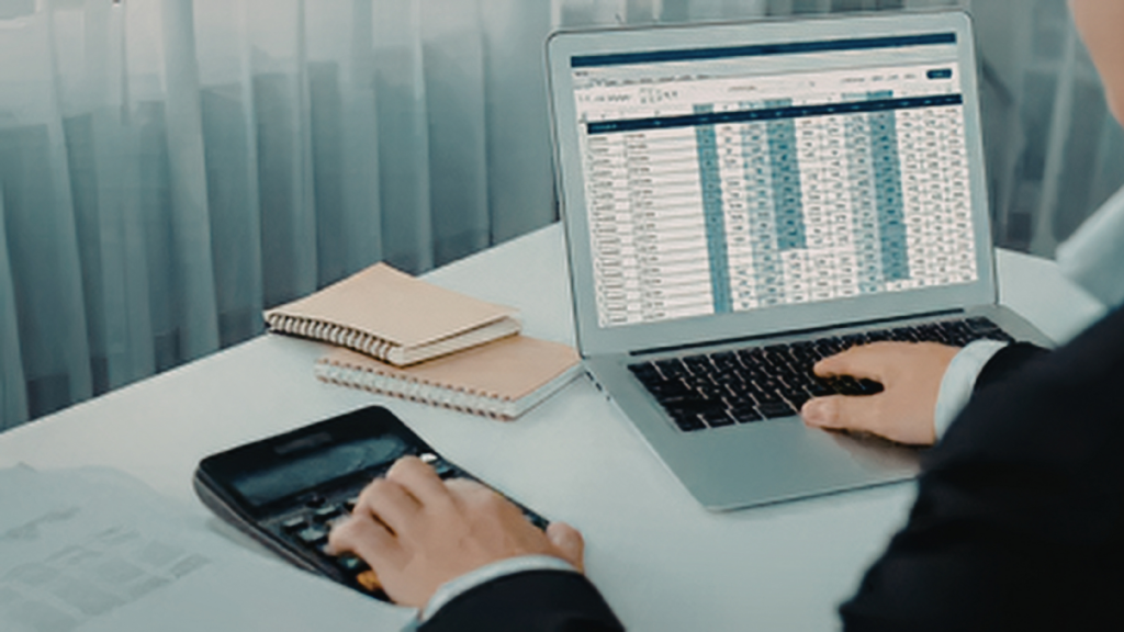 An image of a CPA in Burlington who is reviewing client records in his desktop software.