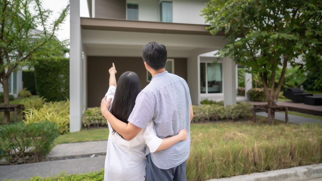 An image of a couple outside of their new property in Burlington Ontario Canada