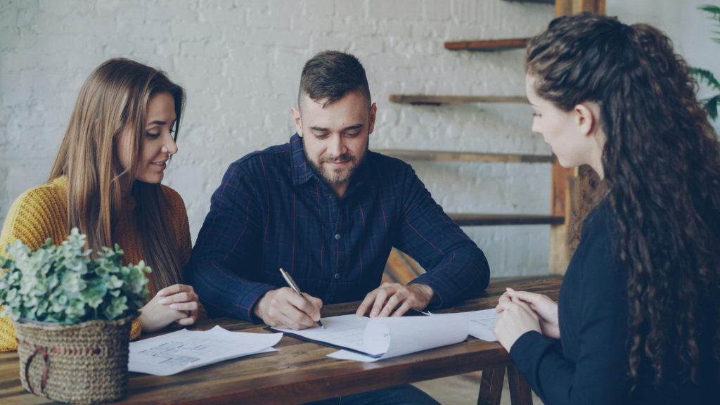 An image of a couple who are meeting with their local advisor to help update their living trust.
