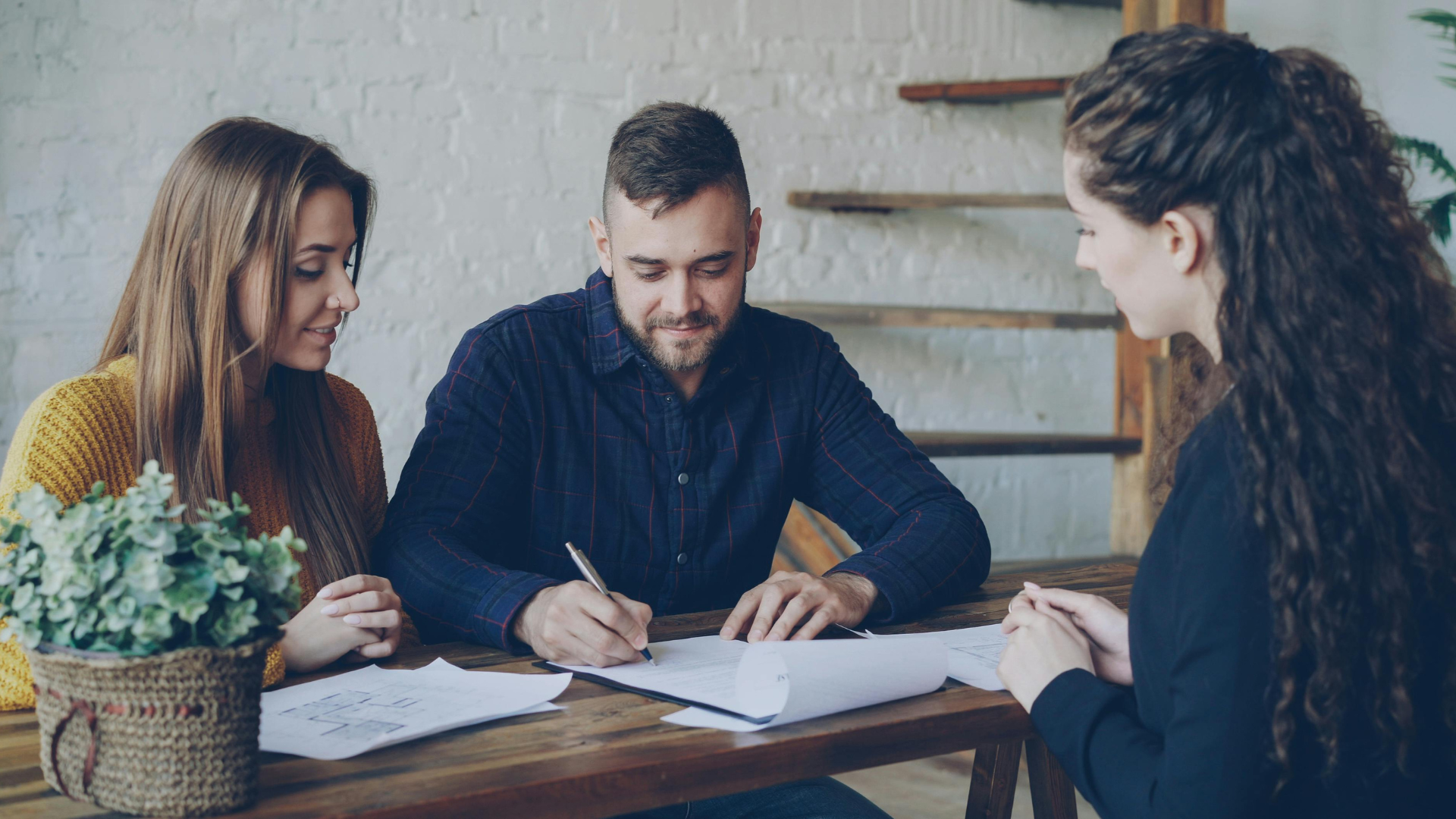 An image of a couple who are meeting with their local advisor to help update their living trust.